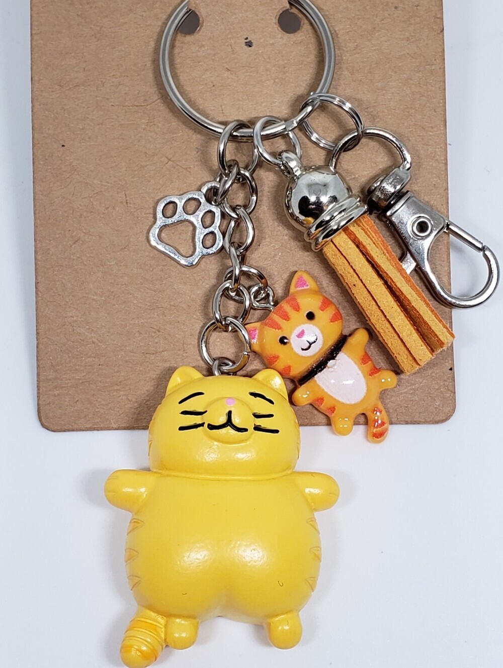Handmade painted resin orange tabby cat paw keychain